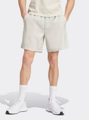 Adidas Szorty w kolorze kremowym rozmiar: L. Brązowe szorty Adidas, l, bez wzorów. Za 83.42 zł.