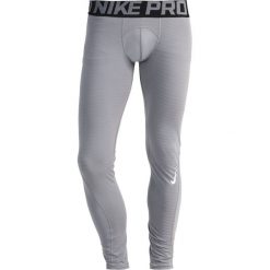 Nike Performance PRO WARM Kalesony grau/schwarz. Spodnie treningowe długie marki Nike Performance. W wyprzedaży za 125.30 zł.