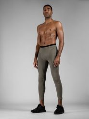 4F Legginsy treningowe z materiałów z recyklingu męskie 4F x Robert Lewandowski S. Brązowe legginsy długie sportowe 4F, l, bez wzorów, z materiału, na fitness i siłownię. W wyprzedaży za 99.99 zł.