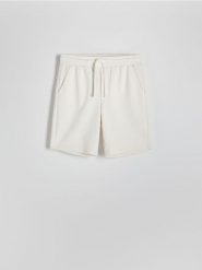 Dresowe szorty - złamana biel. Krótkie spodenki sportowe Reserved, l, bez wzorów, z dresówki. Za 79.99 zł.