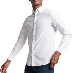 Koszula z długim rękawem z bawełny organicznej Superdry Oxford. Białe koszule Superdry, xl, bez wzorów, z bawełny, bez kołnierzyka, bez ramiączek. Za 258.65 zł.