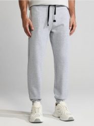 Spodnie jogger - szary. Szare joggery i bojówki Sinsay, l, bez wzorów, z bawełny. Za 29.99 zł.
