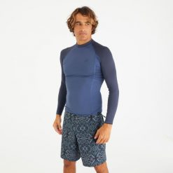Top UV surfingowy męski Olaian 500 UPF50+ długi rękaw. Niebieskie bluzki z długim rękawem OLAIAN, l, bez wzorów, z elastanu, bez kołnierzyka, bez ramiączek. Za 79.99 zł.
