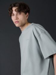 4F T-shirt oversize z bawełny organicznej męski 4F x Robert Lewandowski L. Niebieskie t-shirty 4F, l, bez wzorów, z bawełny, bez kołnierzyka, bez ramiączek. W wyprzedaży za 79.99 zł.