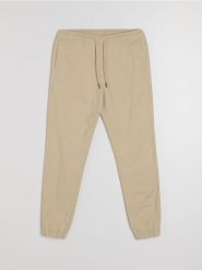 Bawełniane spodnie jogger - beżowy. Brązowe joggery i bojówki Sinsay, bez wzorów, z bawełny. Za 49.99 zł.