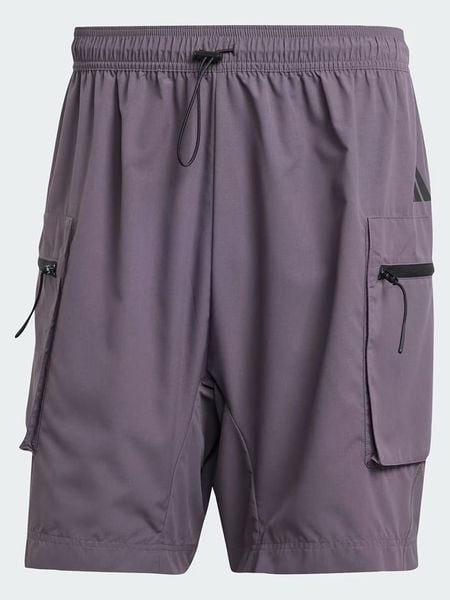 Adidas Bojówki "City Escape" w kolorze fioletowym rozmiar: L. Różowe joggery i bojówki Adidas, l, bez wzorów. Za 104.89 zł.