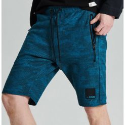 Szorty camo o kroju jogger - Niebieski. Joggery i bojówki marki Cropp. Za 79.99 zł.
