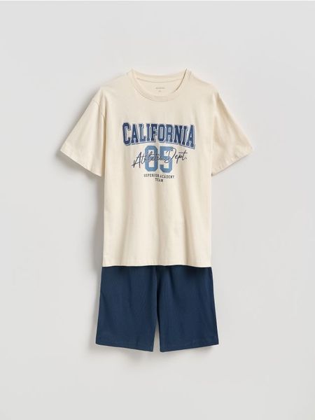 Dwuczęściowa piżama z nadrukiem - złamana biel. Piżamy Reserved, l, bez wzorów, z bawełny, bez ramiączek. Za 89.99 zł.