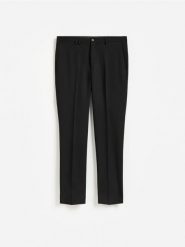 Garniturowe spodnie slim fit - czarny. Czarne garnitury Reserved, l, bez wzorów, z tkaniny. Za 169.99 zł.
