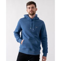 Bluza z kapturem Gant Shield. Niebieskie bluzy z kapturem GANT, l, z aplikacjami, z bawełny, z kapturem. Za 475.55 zł.