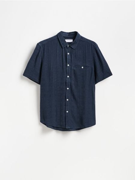 Koszula regular fit w kratę - granatowy. Niebieskie koszule Reserved, l, bez wzorów, z tkaniny, bez kołnierzyka, bez ramiączek. Za 119.99 zł.