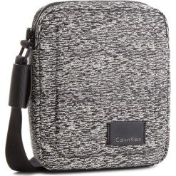 Saszetka CALVIN KLEIN - Ilay Jacquard Report K50K502887 907. Saszetki i nerki marki CALVIN KLEIN. W wyprzedaży za 249.00 zł.