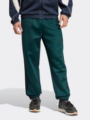 Adidas Spodnie dresowe w kolorze zielonym rozmiar: M. Zielone spodnie treningowe długie Adidas, m, bez wzorów, z dresówki. Za 174.43 zł.