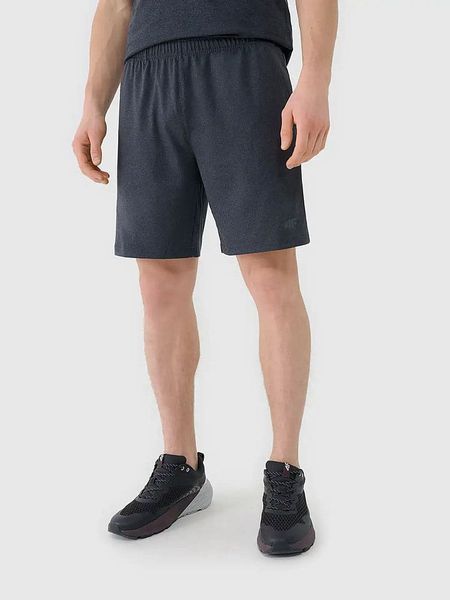 4F Szorty sportowe w kolorze granatowym rozmiar: L. Niebieskie krótkie spodenki sportowe 4F, l, bez wzorów, z materiału. Za 66.16 zł.