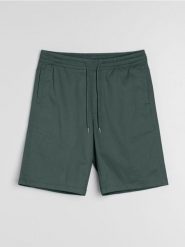 Bawełniane szorty jogger - zielony. Zielone krótkie spodenki sportowe Sinsay, l, bez wzorów, z bawełny. W wyprzedaży za 19.99 zł.