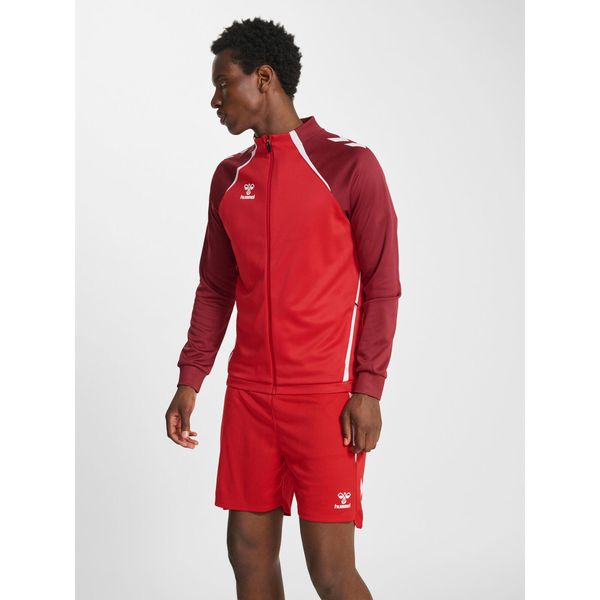 Treningowy top Hummel Lead 2.0. Brązowe swetry nierozpinane Hummel, bez wzorów, z tkaniny, bez kołnierzyka, bez ramiączek. Za 227.00 zł.