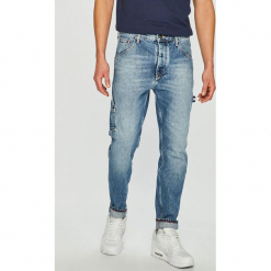 Tommy Jeans - Jeansy Tapered Carpenter. Jeansy marki Tommy Jeans. W wyprzedaży za 429.90 zł.