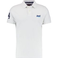 Superdry CLASSIC Koszulka polo optic white. Koszulki polo marki Superdry, z bawełny, polo. Za 189.00 zł.