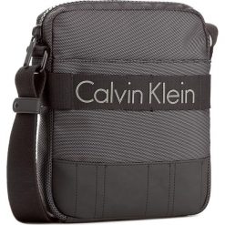 Saszetka CALVIN KLEIN - Madox Reporter K50K502853 001. Saszetki i nerki marki CALVIN KLEIN. W wyprzedaży za 329.00 zł.