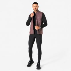 Legginsy do biegania męskie Kiprun Run Flow. Czarne legginsy długie sportowe KIPRUN, l, bez wzorów, z elastanu, do biegania. Za 149.99 zł.