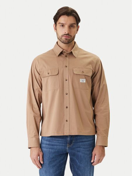 Guess Jeans Koszula M6RH60 WJ921 Brązowy Boxy Fit. Brązowe koszule Guess Jeans, l, z aplikacjami, z bawełny, bez kołnierzyka, bez ramiączek. Za 241.99 zł.