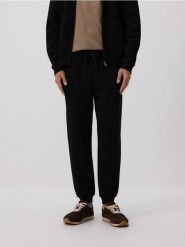 Dresowe spodnie jogger z bawełną - czarny. Czarne joggery i bojówki Reserved, l, bez wzorów, z bawełny. Za 129.99 zł.