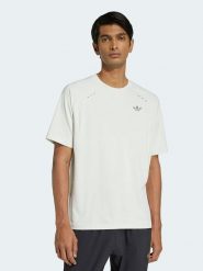 Adidas Koszulka w kolorze kremowym rozmiar: L. Brązowe bezrękawniki Adidas, l, bez wzorów, bez kołnierzyka, bez ramiączek. Za 86.95 zł.