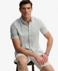 Superdry Klasyczna koszula Seersucker krótki rękaw – 100% bawełna organiczna. Białe koszule Superdry, na lato, xl, bez wzorów, z bawełny, bez kołnierzyka, bez ramiączek. Za 282.85 zł.