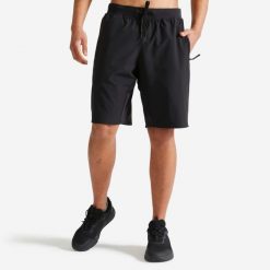 Spodenki fitness cardio męskie Domyos. Czarne szorty DOMYOS, l, bez wzorów, z materiału, sportowe. Za 79.99 zł.