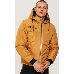 Kurtka z kapturem - Brązowy. Kurtki marki B'TWIN. Za 229.99 zł.