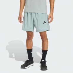 Tkane Szorty Do Ćwiczeń Essentials Base. Zielone szorty Adidas, bez wzorów, sportowe. Za 119.00 zł.