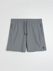 Szorty sportowe Snsy Performance - szary. Szare krótkie spodenki sportowe Sinsay, l, bez wzorów. Za 49.99 zł.