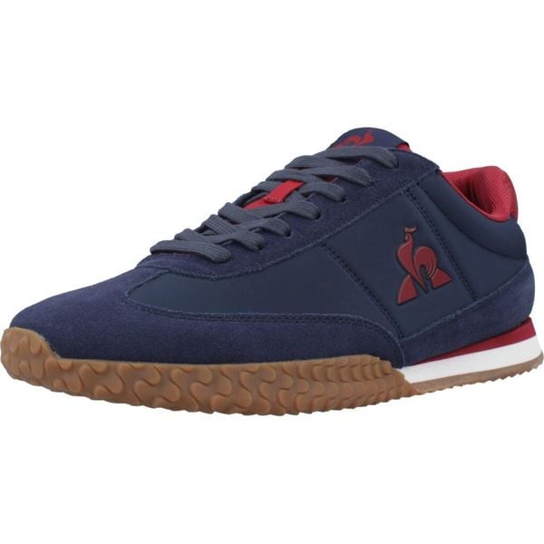 Buty LE COQ SPORTIF VELOCE I Niebieski. Niebieskie buty trekkingowe le coq sportif, bez wzorów, ze skóry, bez zapięcia, trekkingowe. Za 313.99 zł.
