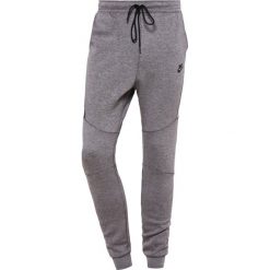 Nike Sportswear TECH JOGGER Spodnie treningowe carbon heather/cool grey/black. Joggery i bojówki marki Nike Sportswear. Za 319.00 zł.