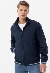 Lekka kurtka ze stójką J-TAWNY. Niebieskie kurtki Volcano, l, bez wzorów, z materiału, bez kaptura. Za 329.99 zł.