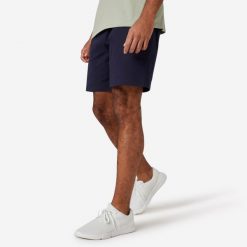 Spodenki fitness męskie Domyos 500 Essentials. Niebieskie krótkie spodenki sportowe DOMYOS, l, bez wzorów, z bawełny. Za 49.99 zł.