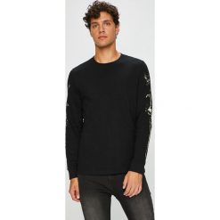 Medicine - Longsleeve Northern Story. Czarne bluzki z długim rękawem MEDICINE, l, z aplikacjami, z bawełny, bez kołnierzyka, bez ramiączek. W wyprzedaży za 49.90 zł.