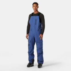 Spodnie narciarskie z szelkami i kieszenią cargo Helly Hansen Sogn. Niebieskie spodnie narciarskie i snowboardowe Helly Hansen, m, bez wzorów, narciarskie. Za 1,037.00 zł.