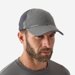 Czapka wędkarska z daszkiem Caperlan FC 500 F składana. Brązowe czapki z daszkiem CAPERLAN, bez wzorów, z materiału. Za 54.99 zł.