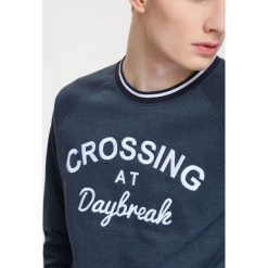 BLUZA NIEROZPINANA MĘSKA LUŹNA, REGLAN. Bluzy z kapturem marki TOP SECRET. W wyprzedaży za 59.99 zł.