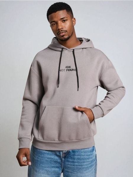Bluza hoodie z napisem - szary. Szare bluzy bez kaptura Sinsay, l, bez wzorów, bez kaptura. W wyprzedaży za 25.99 zł.