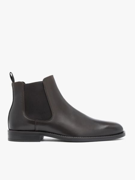 Brązowe skórzane sztyblety. Brązowe sztyblety Brawo sp. z o.o., bez wzorów, ze skóry, przed kolano, bez obcasa, na płaskiej podeszwie, bez zapięcia. Za 599.99 zł.