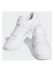 Adidas Skórzane sneakersy "Rivalry" w kolorze białym rozmiar: 39 1/3. Białe buty sportowe casual Adidas, bez wzorów, bez zapięcia. Za 218.57 zł.