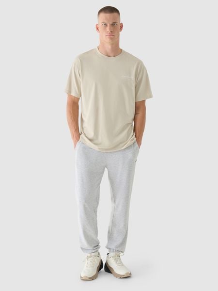 4F T-shirt oversize z nadrukiem męski - beżowy L. Brązowe t-shirty 4F, l, bez wzorów, z bawełny, bez kołnierzyka, bez ramiączek. W wyprzedaży za 29.99 zł.