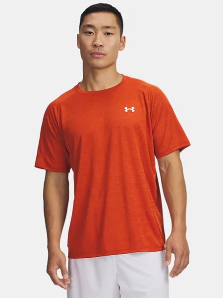 Under Armour Koszulka funkcyjna w kolorze pomarańczowym rozmiar: 3XL. Pomarańczowe t-shirty sportowe Under Armour, bez wzorów, z materiału, bez ramiączek, outdoorowe. Za 104.89 zł.