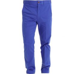 Polo Ralph Lauren Golf TAILOREDFIT GOLF Spodnie materiałowe summer royal. Spodnie materiałowe marki Polo Ralph Lauren Golf. W wyprzedaży za 439.20 zł.