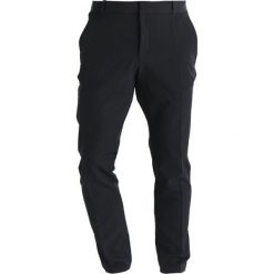 Nike Performance FLEX PANT Spodnie materiałowe black. Spodnie treningowe długie marki Nike. Za 399.00 zł.