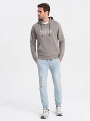 Męskie spodnie jeansowe JOGGERY z przetarciami - jasnoniebieskie V1 OM-PADJ-0150 - XXL. Niebieskie joggery i bojówki Ombre Clothing, l, bez wzorów, z bawełny. W wyprzedaży za 69.99 zł.