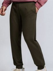 Spodnie jogger slim fit - zielony. Zielone joggery i bojówki Sinsay, l, bez wzorów. Za 29.99 zł.