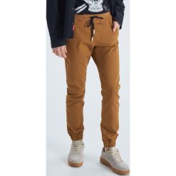 Spodnie joggery - Żółty. Joggery i bojówki marki Cropp. Za 129.99 zł.